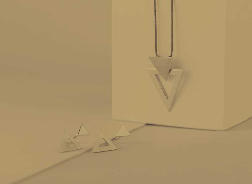 Cultural significance of the upside-down triangle necklace
