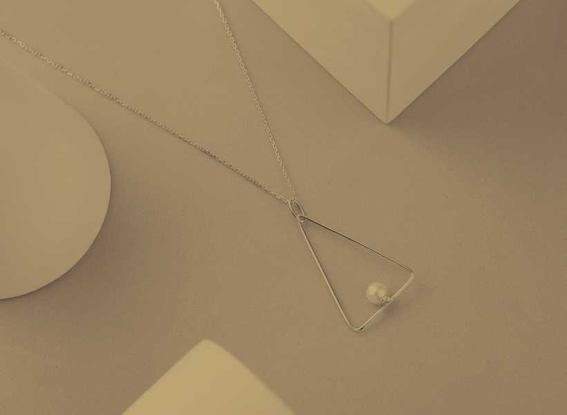 Religious Significance Of The Upside-Down Triangle Necklace